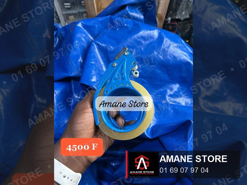 Dévidoir de ruban adhésif compact bleu en métal, tenu dans la main